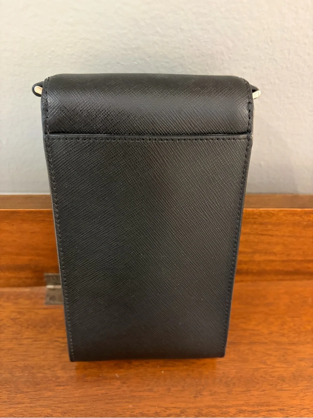 kate spade black saffiano leather phone pouch with gold logo